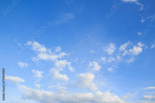 White cloud and blue sky background.