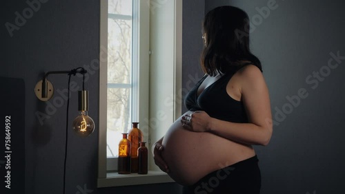 Pregnant woman expecting twins, getting ready for labor