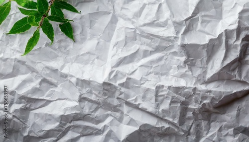 crumpled paper on a green background, a close up of a multicolored piece of paper, an abstract sculpture