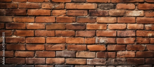 A detailed close up of a brown brick wall showcasing the intricacies of brickwork. Each brick is a rectangular building material forming an artistic composite structure