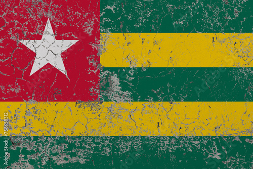 Destructible, crumbling stone wall. Conceptual background in colors flag of Togo