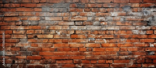 A detailed closeup of an aged brown brick wall showcasing the intricate patterns of the brickwork, displaying a unique blend of art and building material