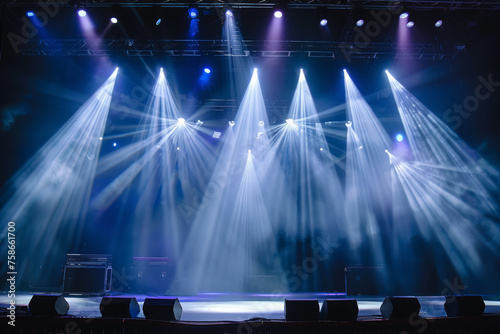 many turned on blue spotlights illuminate an empty stage, a background for a splash screen or filling, a performance, a show photo