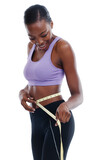 Fitness, tape measure and waist with happy black woman in studio isolated on white background for weight loss. Exercise, smile and diet with young sports model training for health or nutrition