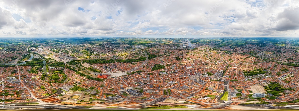 Bruges, Belgium. City center and surroundings. Residential and industrial areas. Panorama of the city. Summer day, cloudy weather. Panorama 360. Aerial view