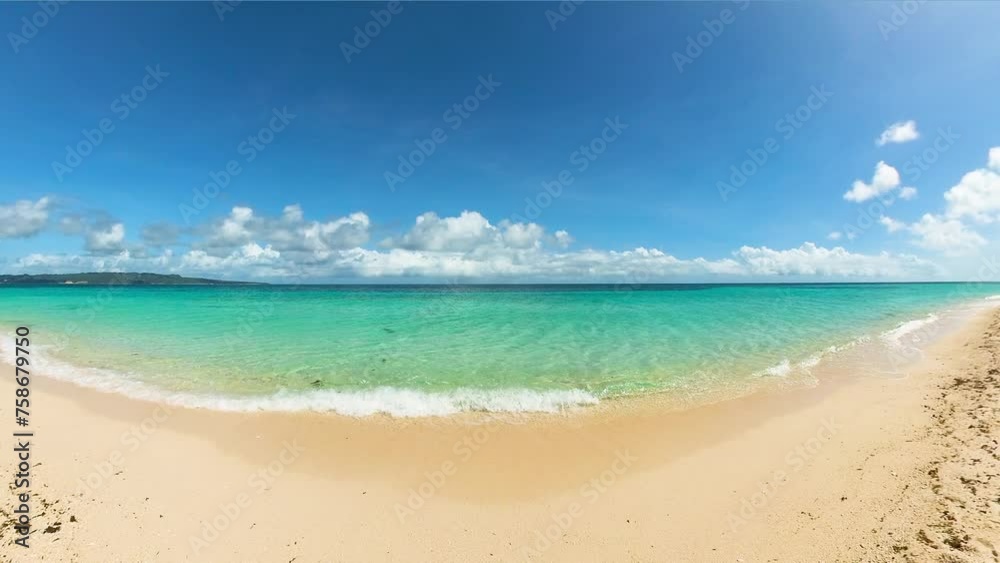 Stunning clear ocean waves crashing on white sand in Puka Beach. Boracay Island. Philippines. Stunning clear ocean waves crashing on white sand in Puka Beach. Boracay Island. Philippines.