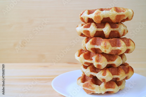 Plate of Tasty Belgian Waffles Stack on Wooden Table