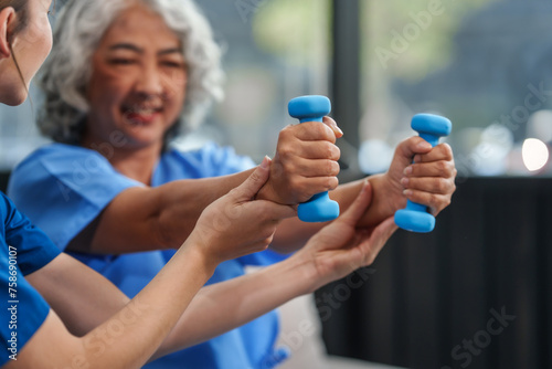 A young Caucasian physical therapist and an elderly Asian woman in her 60s attended a physical therapy course regarding muscle pain and muscle weakness. and heel pain with elastic bands