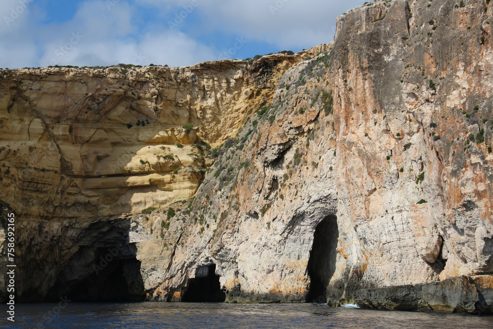 Grottoes on the steep cliffs of the island of Malta