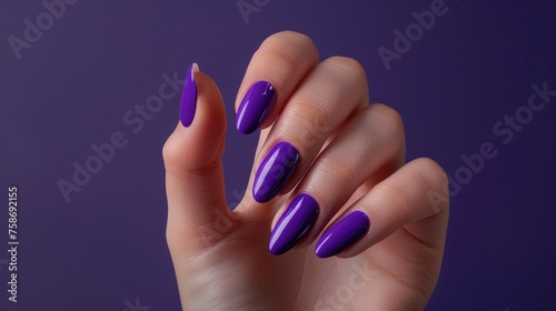 Beautiful women's manicure with purple polish on the nails