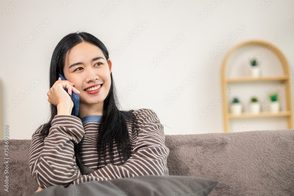 Women doing activities inside the house Communicate via smartphone happily Women doing activities inside the house Communicate via smartphone happily