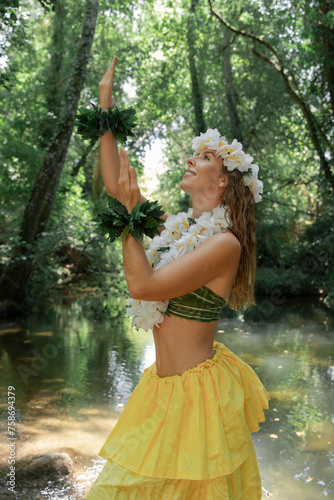 Woman elegantly showcasing Polynesian dance outside in the green jungle. Concept of Pacific cultural beauty. Sensation of joy and celebration.