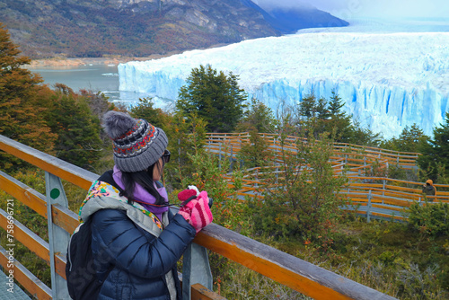 Female Traveler Looking at the Massive Glacier of Perito Moreno, an Amazing UNESCO World Heritage Site in Patagonia, Argentina, South America