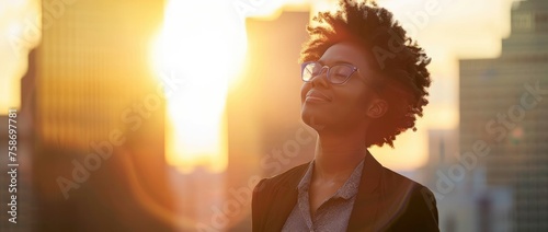 Empowered African American businesswoman enjoying cityscape at sunset, symbolizing urban success and career satisfaction with vibrant skyline backdrop - AI generated
