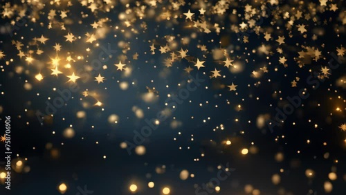 Abstract gold bokeh and shimmer on dark blue background. photo