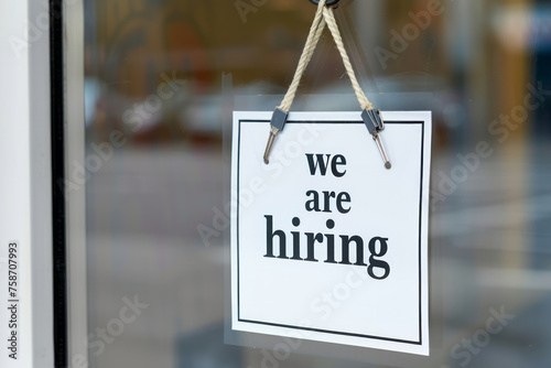 We are hiring sign in a shop or office window