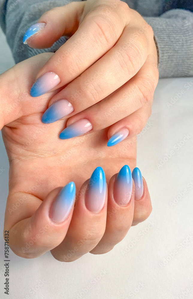 Fototapeta premium Blue Ombre Gel Nails Polish Manicure