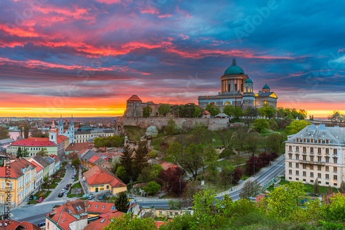 Colourful dusk with rainy clouds above behind the illuminated basilica of Esztergom in Hungary. photo