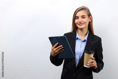 Young successful business lady using a tablet to check emails