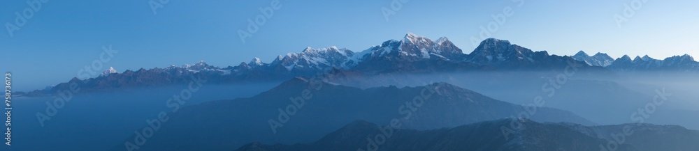 Obraz premium Great Himalayan Mountain range including mount Everest panorama. Landscape in Nepal in morning mist.