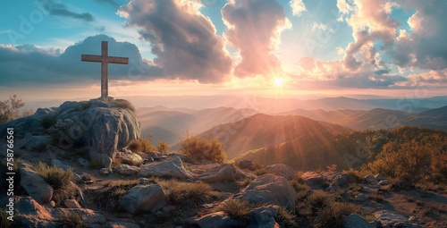 Silhouettes of crucifix symbol on top mountain with bright sunlight on the colorful sky background.