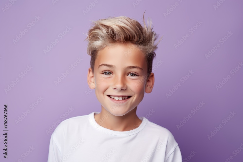 Portrait of a cute young boy with blond hair on a purple background Portrait of a cute young boy with blond hair on a purple background