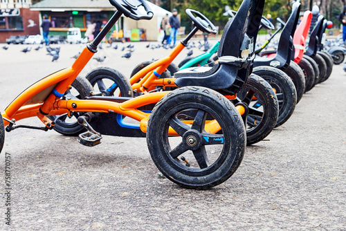 children's bicycle cars for rent in the city square