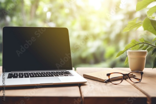 A cozy remote work setup with a closed laptop, notebook, eyeglasses, and a cup of coffee, all bathed in soft natural light. Serene Home Office with Coffee and Nature View