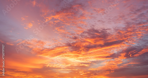  Panoramic view of sunset golden and blue sky nature background. Colorful dramatic sky with cloud at sunset.Sky background.Sky with clouds at sunset.