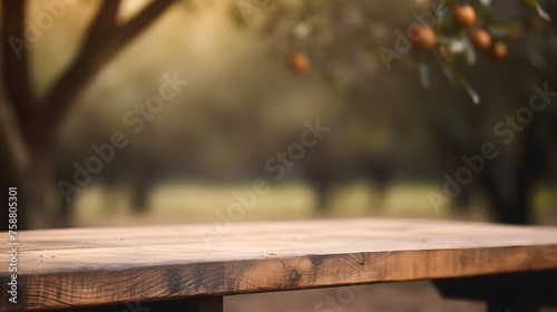 Empty wooden table in front of blur tree branch background