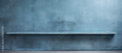 Blank concrete wall against a blue cement background.