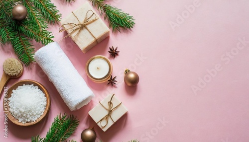 composition with spa accessories christmas decorations and gift box on pink background