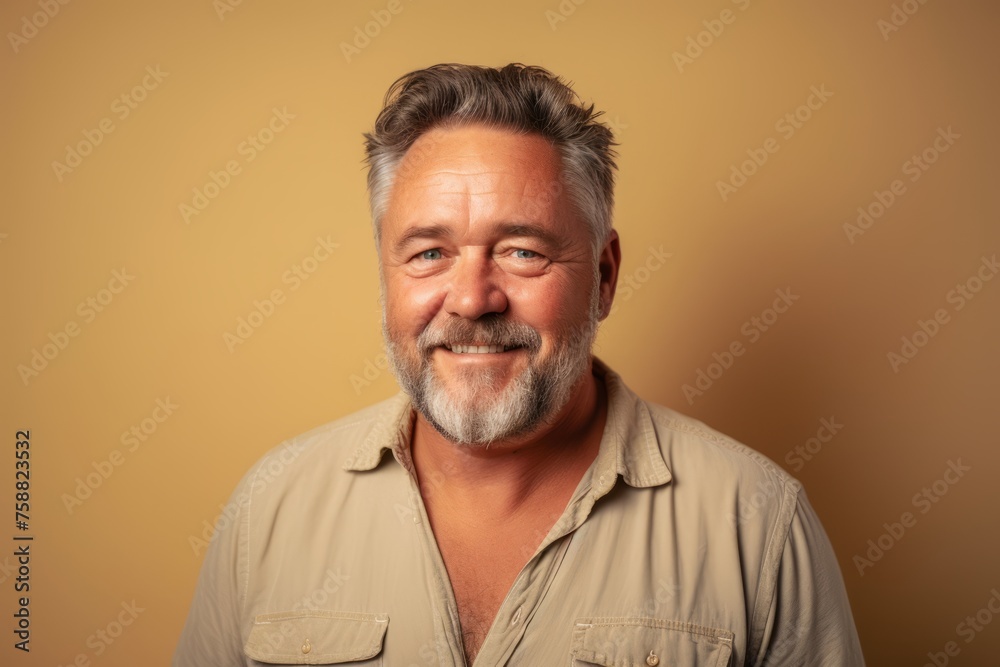 Portrait of a handsome senior man with grey hair and beard wearing casual shirt. Portrait of a handsome senior man with grey hair and beard wearing casual shirt.