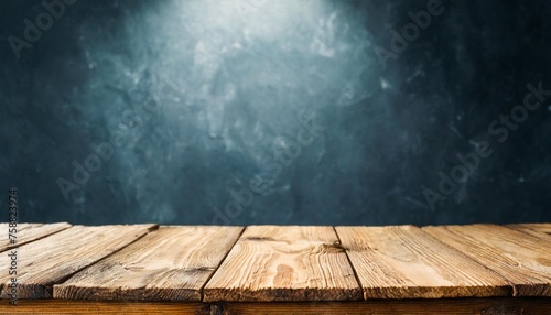 empty wooden table on a background of dark blurred wall empty space for product above
