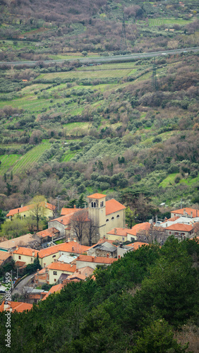 View from the top of the church of a mountain village near Trieste on a cloudy day