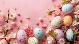 Easter eggs and flowers on pink background