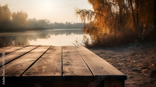 Empty wooden table in front of river background