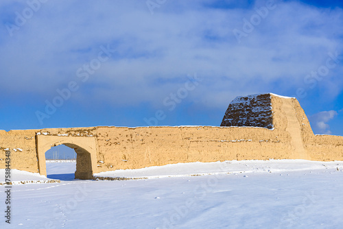 Snow view of Ming Great Wall ruins in Jiayuguan, Gansu Province, China photo