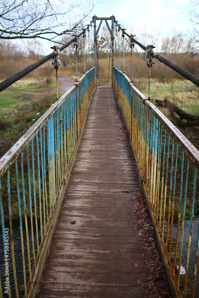 wooden bridge over the river