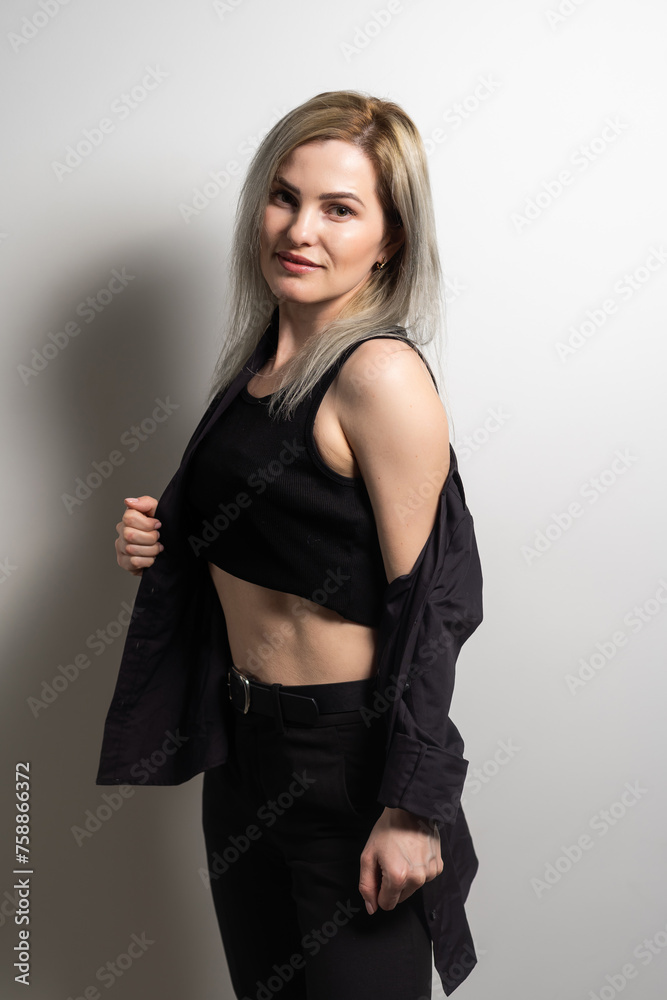 Image of happy young business woman posing isolated over grey wall background. Image of happy young business woman posing isolated over grey wall background.