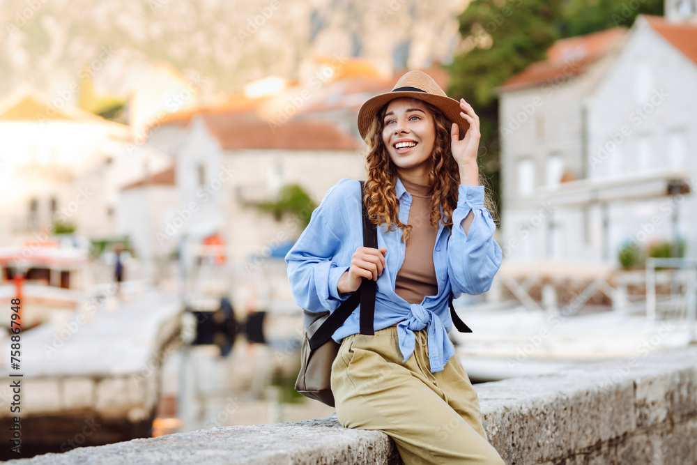 Happy tourist walks the streets and enjoying architecture of the city. Lifestyle, travel, tourism, active life. Happy tourist walks the streets and enjoying architecture of the city. Lifestyle, travel, tourism, active life.