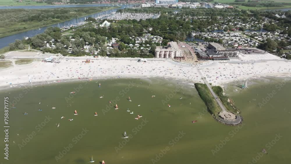 Aerial view of campsite and busy beach during summer, Makkum, Netherlands Aerial view of campsite and busy beach during summer, Makkum, Netherlands