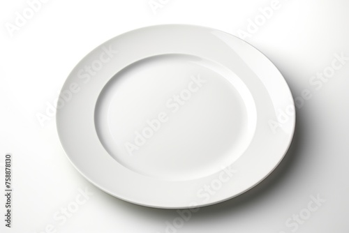 A simple white plate on a white table, ideal for food photography