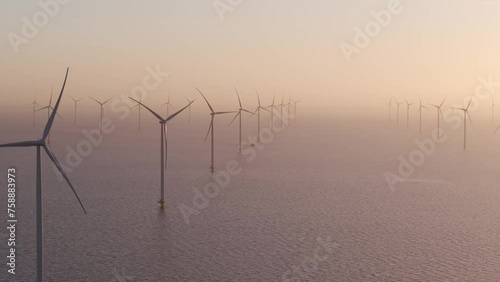 Aerial view of ship cruising in sea at Windpark Friesland at dawn, Netherlands photo