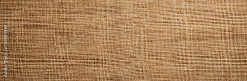 A texture of burlap sack  showcasing its rough and rugged appearance. This coarse material adds a rustic and organic feel to designs  ideal for conveying a sense of natural charm and authenticity