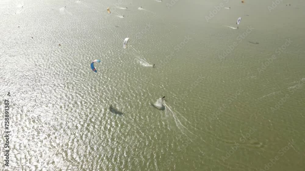 Aerial view of kitesurfing extreme sport with the wind at lake, Netherlands Aerial view of kitesurfing extreme sport with the wind at lake, Netherlands