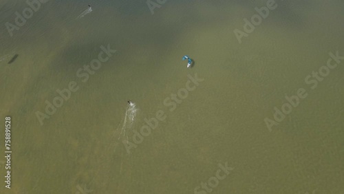 Aerial view of kitesurfing extreme sport with the wind at lake, Netherlands