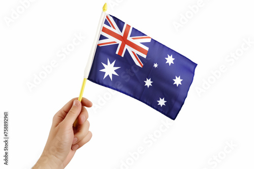 A hand holding a flag with the Australian flag © Sascha