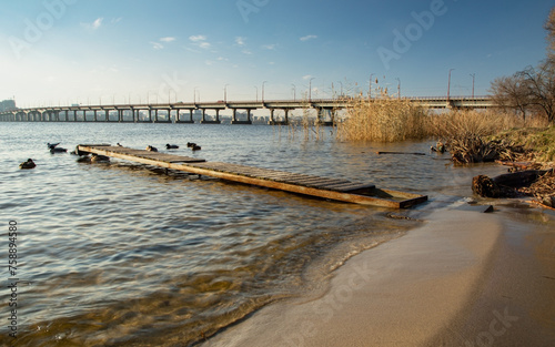 Wallpaper Mural Dnipro river, Dnipro city, Ukraine. Cityscape with blue sky with clouds and river, and city buildings. Torontodigital.ca