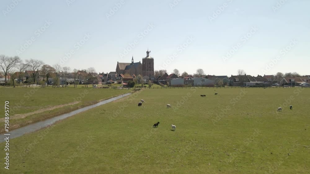 Aerial view of catholic church with dutch flag at kingsday, Workum, Friesland, Netherlands
